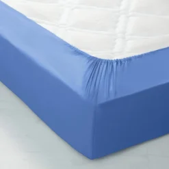 Drap-housse uni polyester-coton 57 fils/cm² - bonnet 32 cm