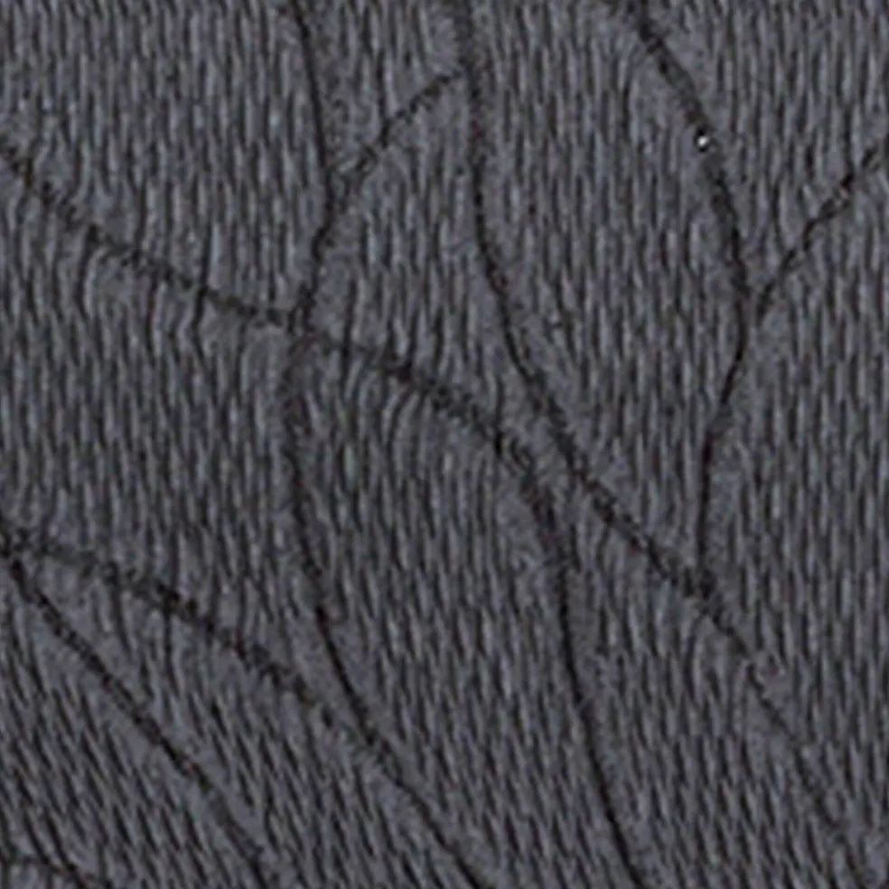 Housse extensible motif jacquard "serpentins" pour fauteuil et canapé
