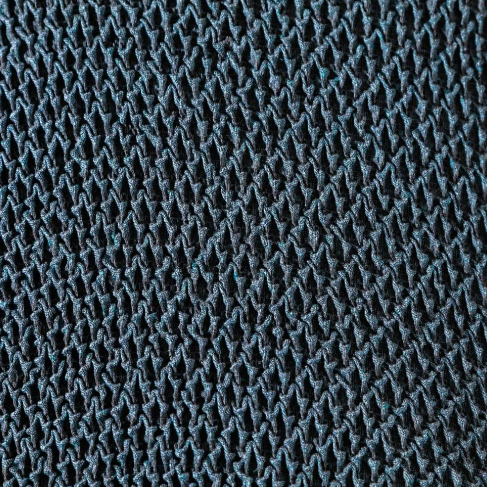 Housse texturée bi-extensible spéciale canapé fauteuil à accoudoirs