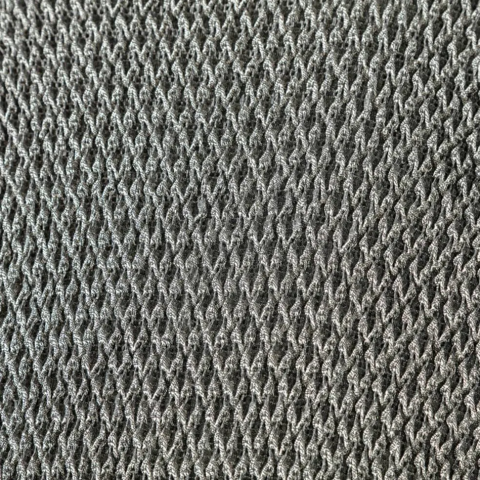 Housse texturée bi-extensible spéciale canapé fauteuil à accoudoirs