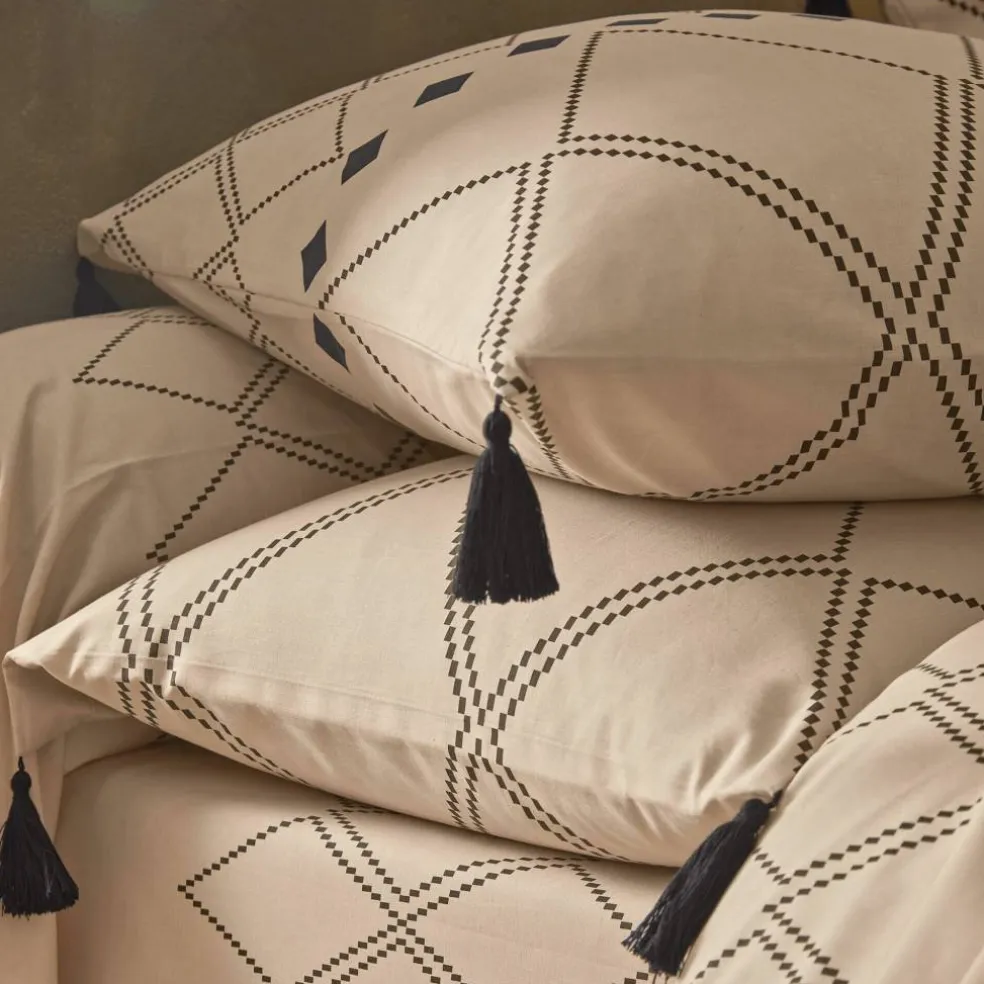 Linge de lit Massaï coton à motifs graphiques et finitions pompons