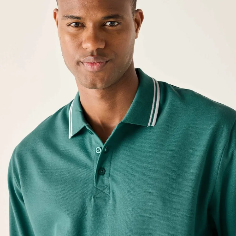 Polo uni maille piquée manches longues